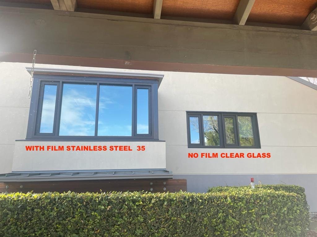Side-by-side comparison of windows with stainless steel window film and untreated clear glass