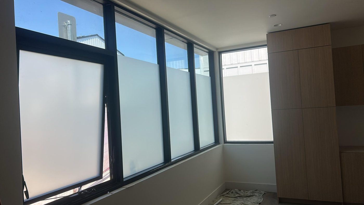 Office partition windows with frosted privacy film