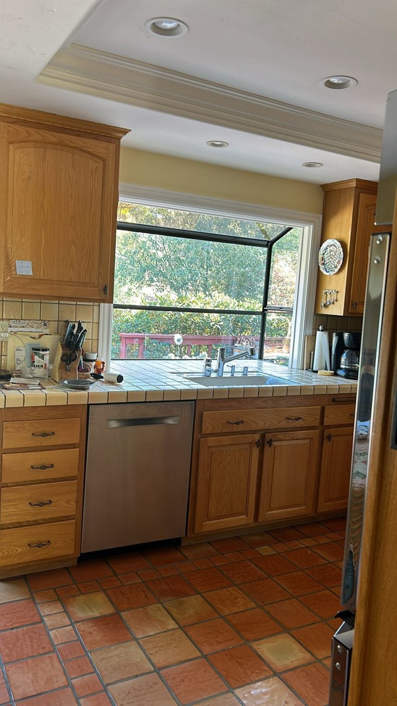 Home kitchen with window film on the garden-facing window