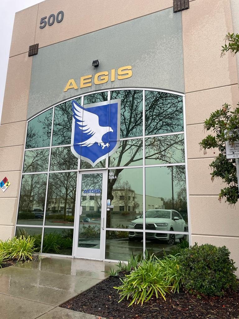 Office building entrance with reflective solar film on floor-to-ceiling glass