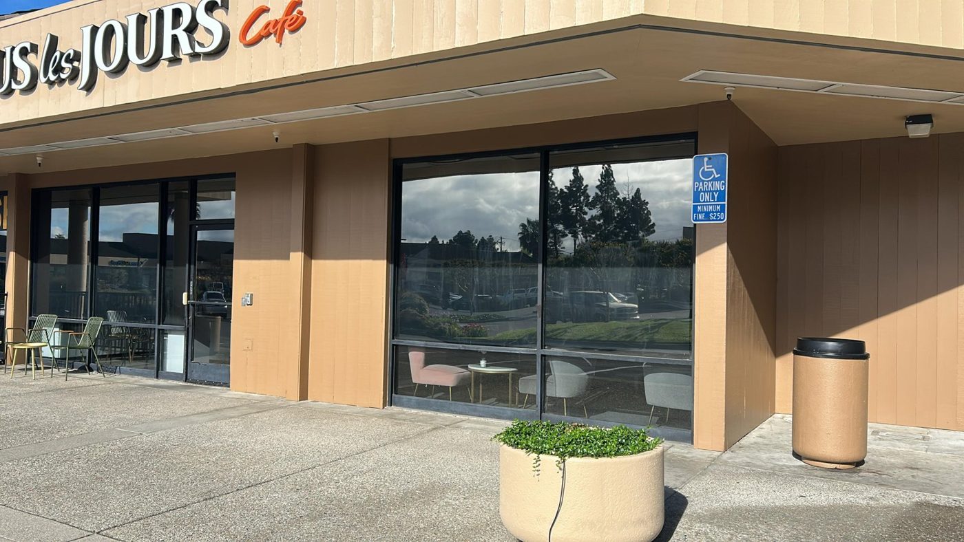 Cafe storefront windows with dark solar control window film