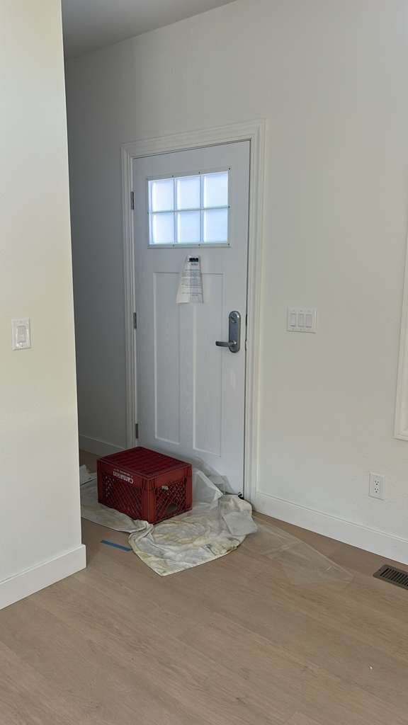 Interior entry door with a frosted privacy film panel