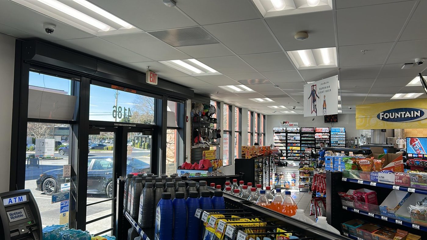 Interior of a convenience store with tinted storefront glass reducing glare