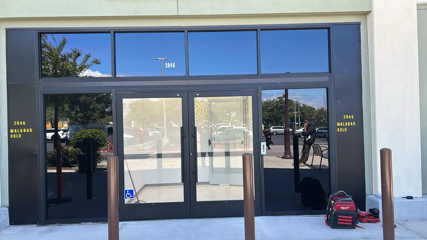 Retail storefront aluminium entry doors with window film