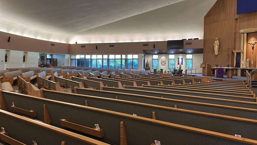 Church sanctuary interior with window film reducing glare on the pews