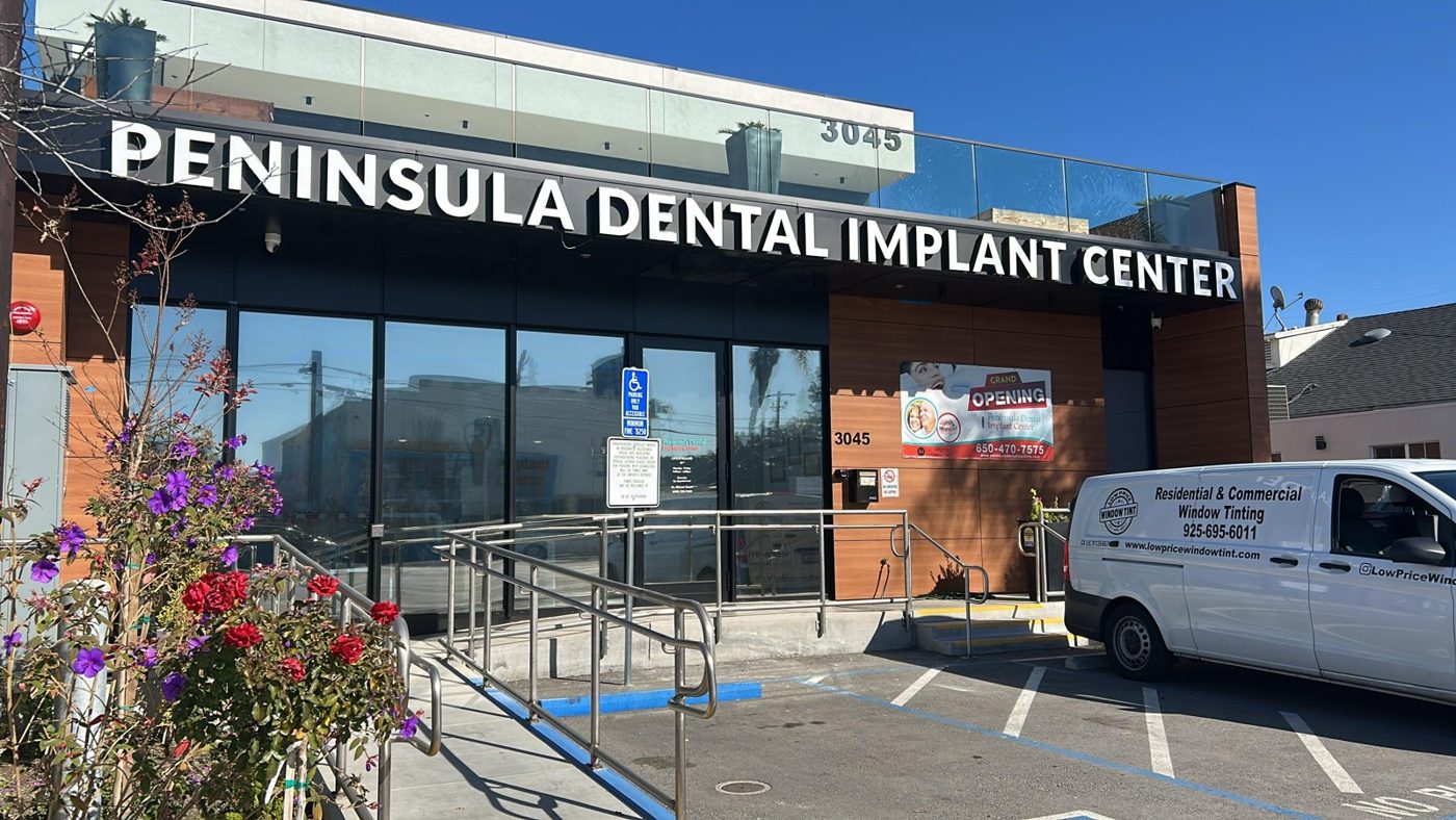 Dental implant center storefront with window film on the entry glass