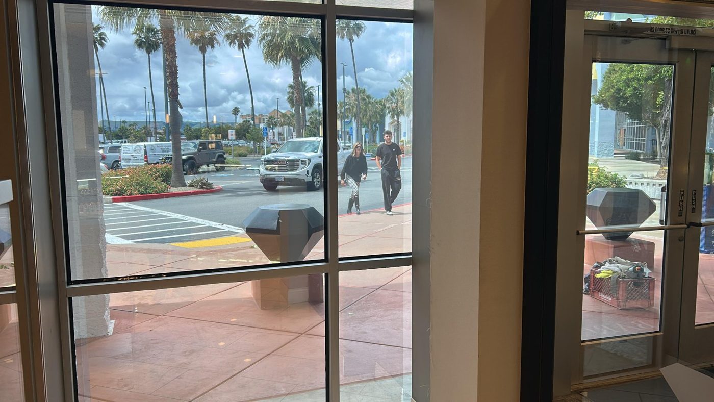 Storefront glass fitted with clear safety and security window film