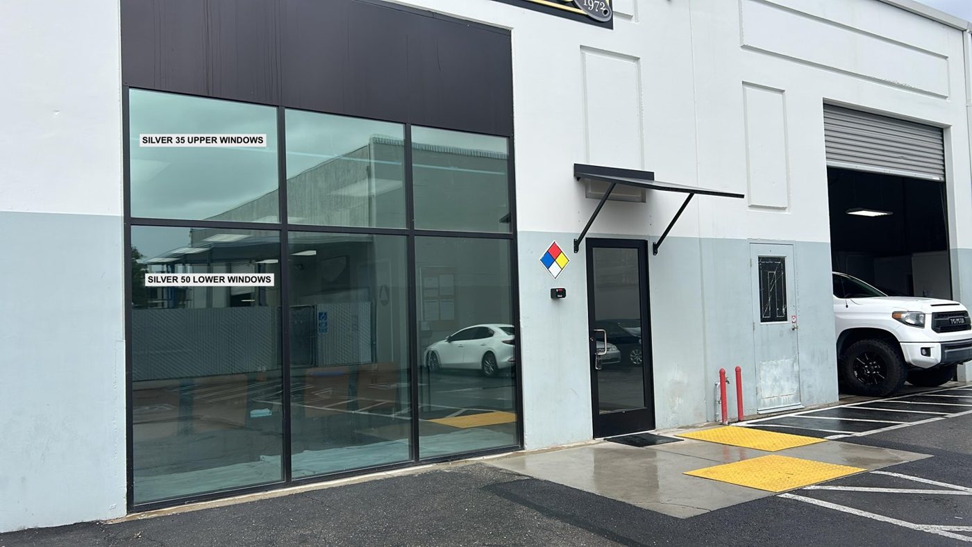 Two shades of reflective solar control window film, Silver 35 on the upper windows and Silver 50 on the lower windows, installed side by side on a commercial building elevation